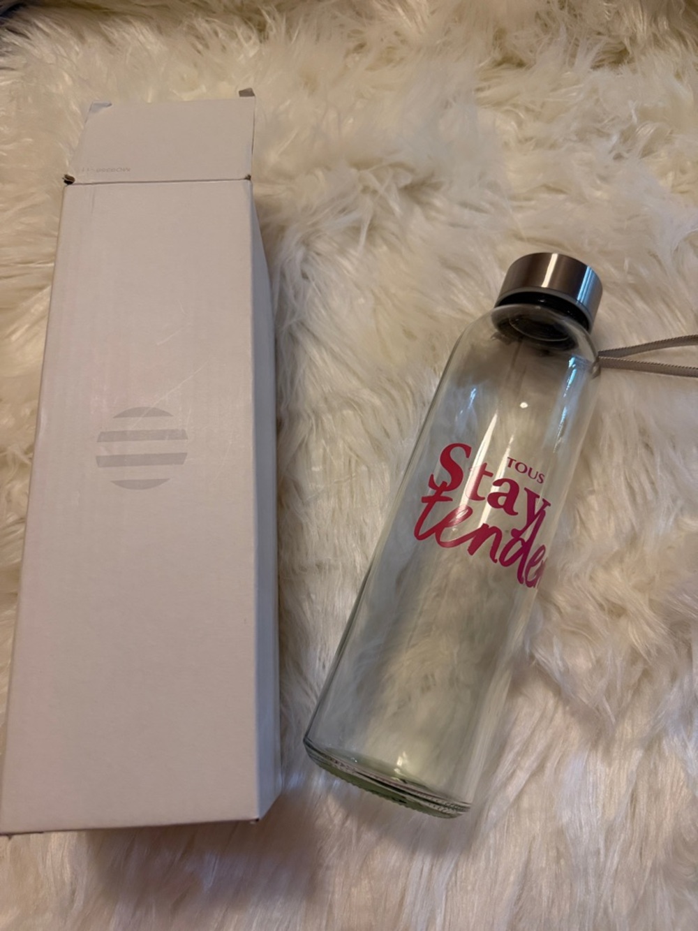 Tous Clear Glass Bottle with Pink 'Stay Tender' Logo and Silver Cap